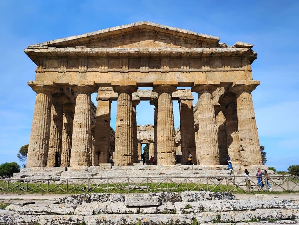 Temple of Hera II (Temple of Neptune) at Paestum, southern Italy, the ancient Doric temple with visitors on its steps.