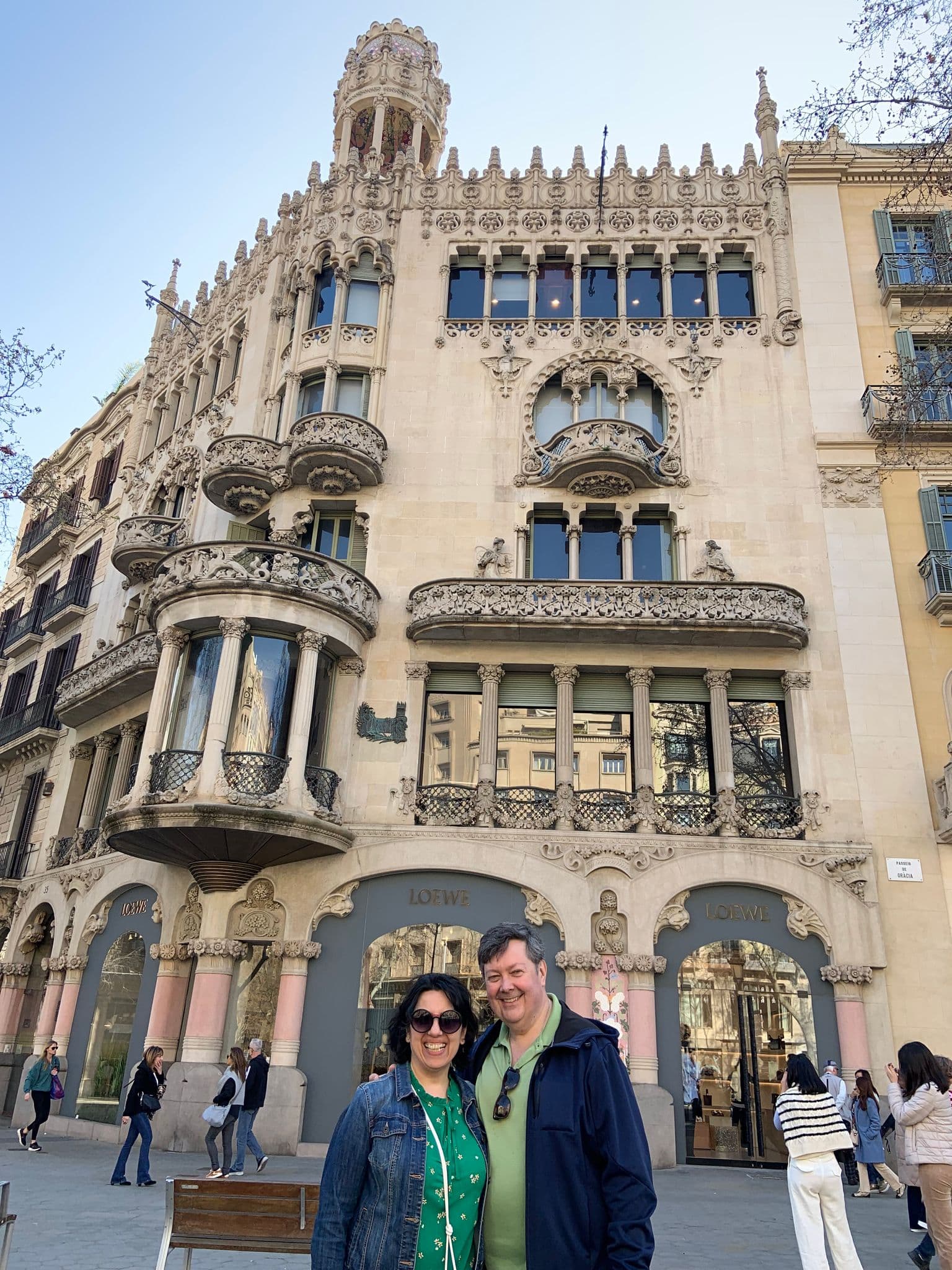 Casa Lleó i Morera on Passeig de Gràcia with a couple posing in front, Barcelona, Spain.