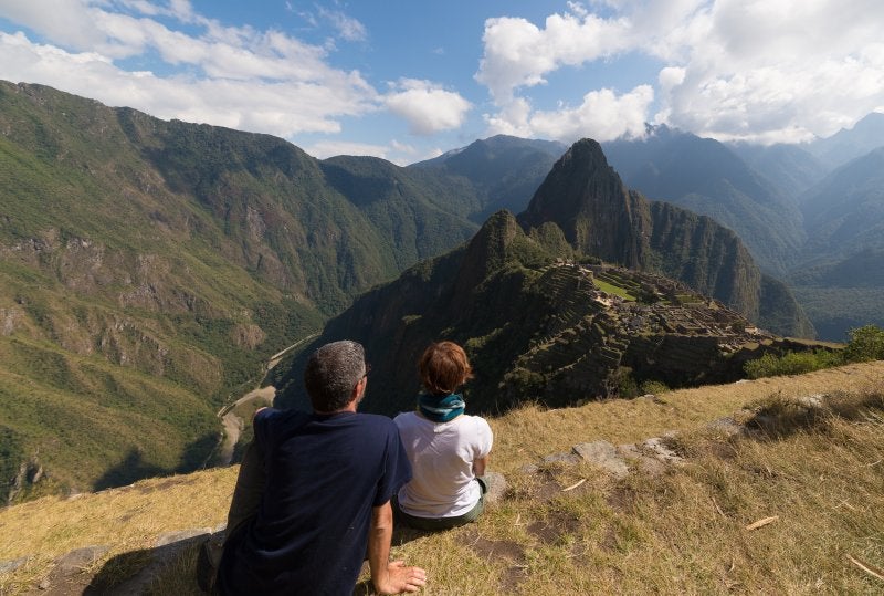 Couple looking at Machu Picchu