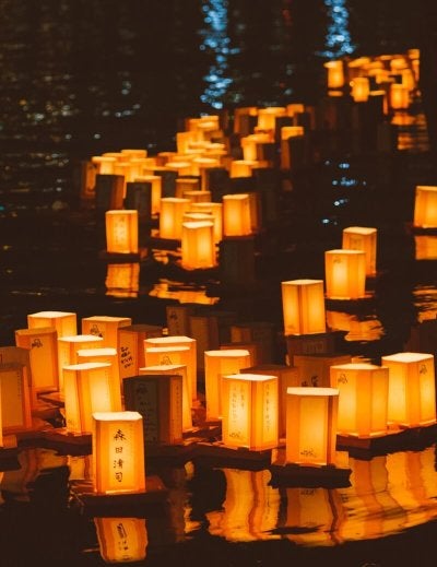 white and black Japanese candles on black surface