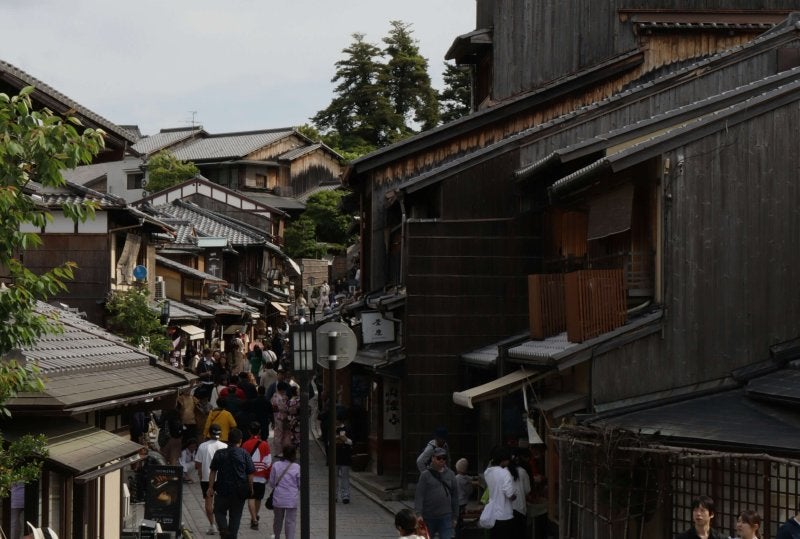Group of travelers walking in Kyoto’s city center