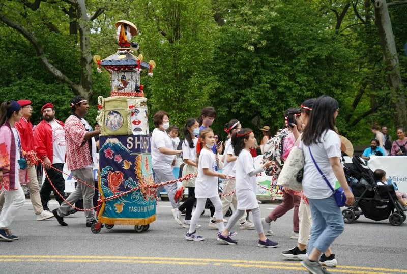 a group of people walking down a street