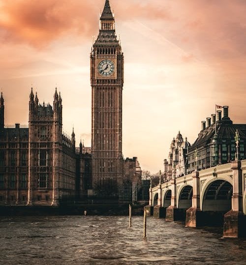 Big Ben at sunset with London skyline and Westminster Bridge