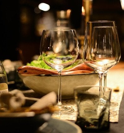 Fine dining restaurant table with wine glasses and candlelight ambiance