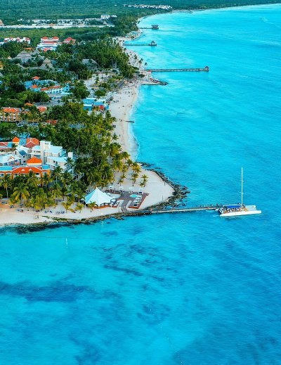 Aerial view of Dominican Republic beach with turquoise water and coastal resorts