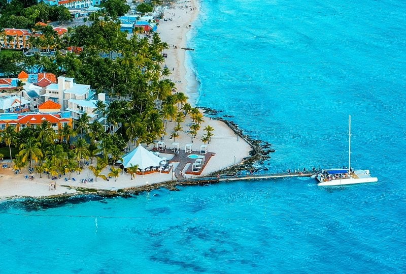 Aerial view of Dominican Republic beach with turquoise water and coastal resorts