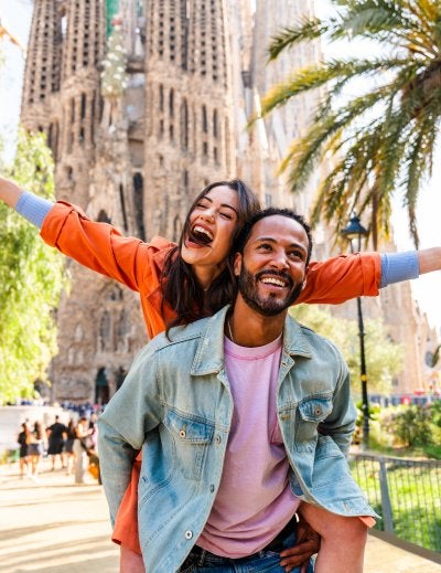 Happpy couple of lovers dating at Sagrada Familia