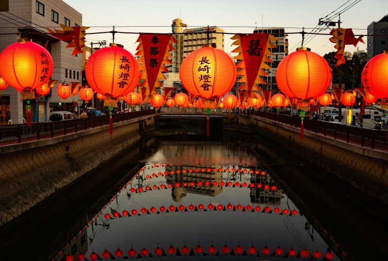 Nagasaki Lantern Festival with illuminated lanterns reflecting in canal
