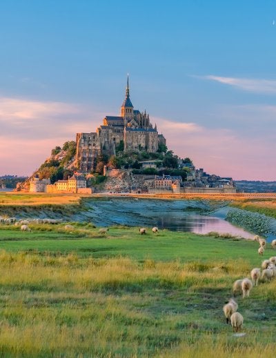 Mont Saint-Michel at sunset twilight in Normandy, northern France