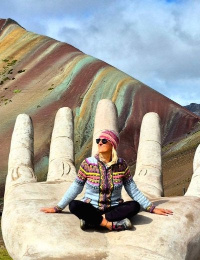woman in vinicunca rainbow mountain