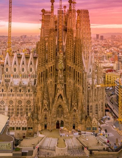 Aerial view of the Sagrada Família and Barcelona skyline at sunset