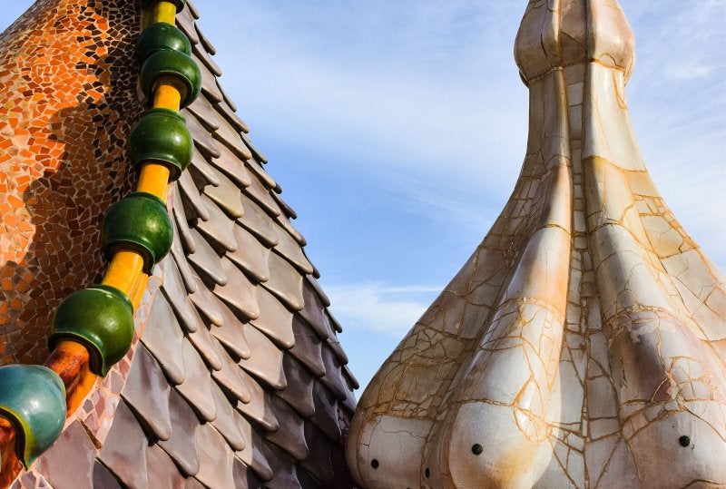 Colorful ceramic dragon-back tiles on the rooftop of Casa Batlló in Barcelona