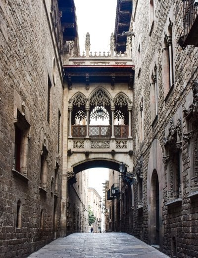 Narrow stone archway street in Barcelona