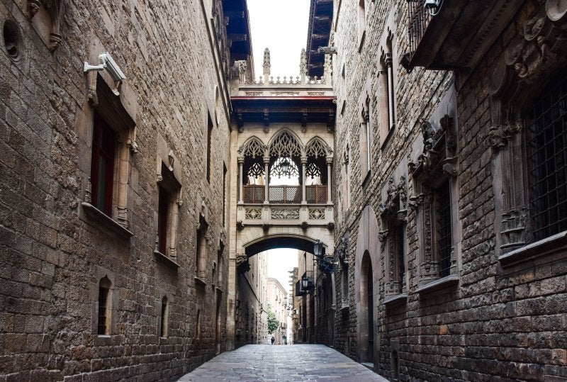 Narrow stone archway street in Barcelona