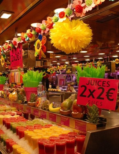 Colorful fruit stalls inside La Boqueria Market in Barcelona