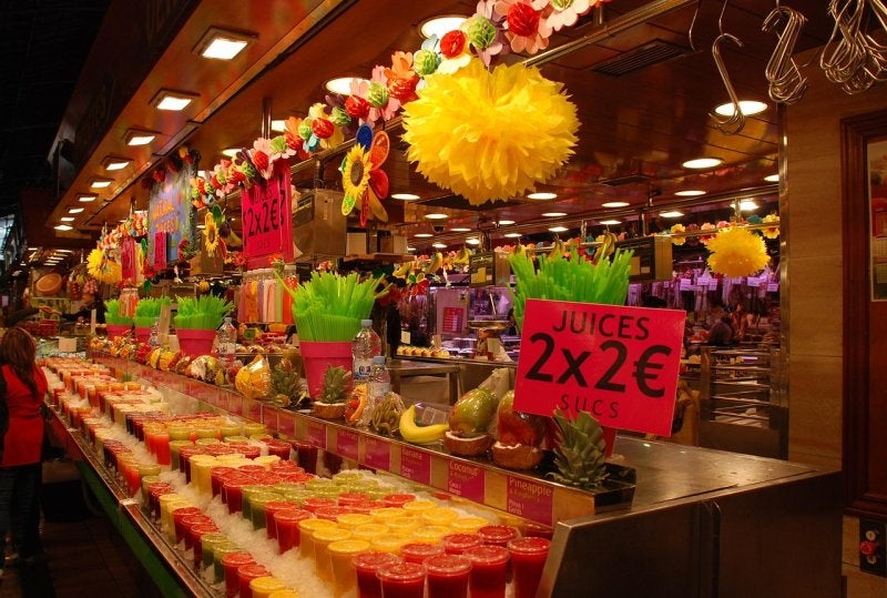 Colorful fruit stalls inside La Boqueria Market in Barcelona