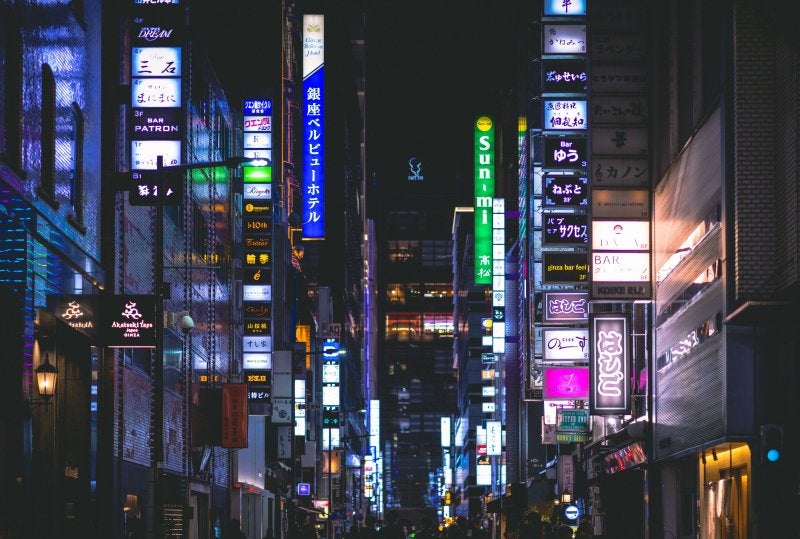 Ginza's Chuo-dori boulevard in Tokyo lined with luxury flagship stores and zelkova trees
